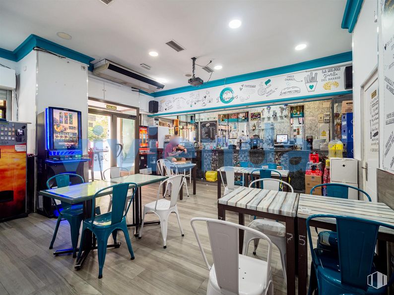 Retail for sale at Calle Arcos, San Blas - Canillejas, Madrid, 28032 with chair, kitchen & dining room table, table, person, furniture, blue, product, lighting, building and interior design around