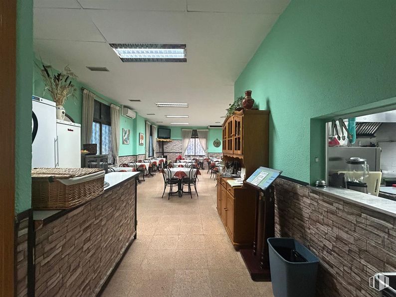 Retail for sale at Zona Fuenlabrada, Fuenlabrada, Madrid, 28944 with waste container, light fixture, cabinetry, flooring, furniture, floor, restaurant, kitchen & dining room table, chair and houseplant around