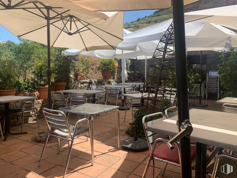 Retail for sale at Calles Azas, 29, Patones, Madrid, 28189 with chair, table, umbrella, kitchen & dining room table, table top, furniture, property, plant, shade and interior design around