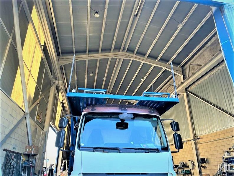 Industrial for sale at Poligono Alcamar, Camarma de Esteruelas, Madrid, 28816 with truck, hood, vehicle, blue, tire, car, motor vehicle, automotive lighting, bumper and automotive design around