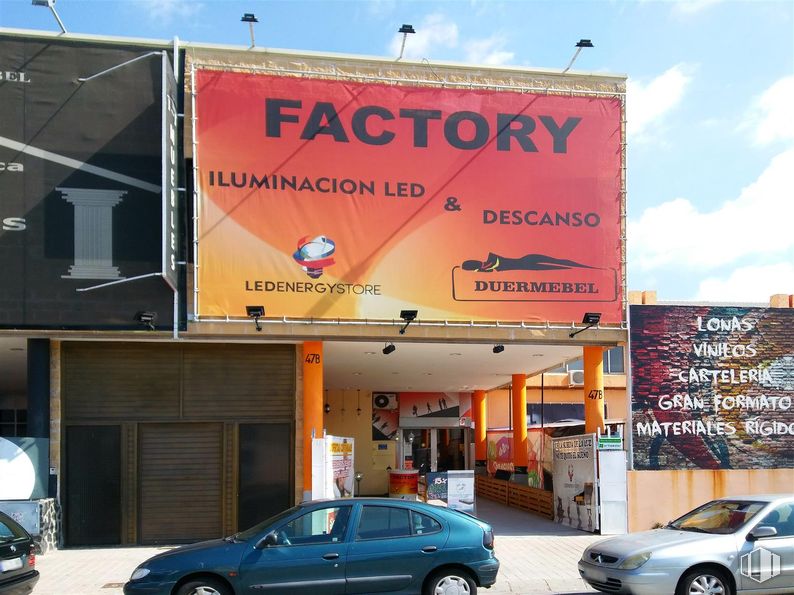 Industrial for rent at Calle Polvoranca, Alcorcón, Madrid, 28923 with car, advertising, orange, logo, banner, display device and sign around