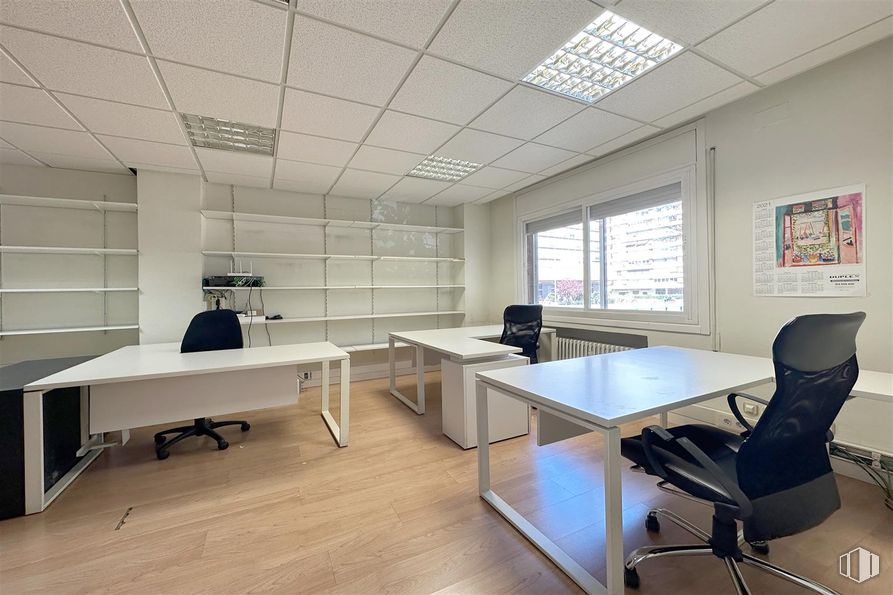 Office for rent at Avenida América, Salamanca, Madrid, 28002 with chair, desk, window, light fixture, lighting, table, furniture, interior design, flooring and wall around