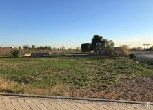 Land for sale at Calle Pirotecnia, Vicálvaro, Madrid, 28052 with sky, plant, natural landscape, tree, land lot, asphalt, road surface, grassland, residential area and plain around