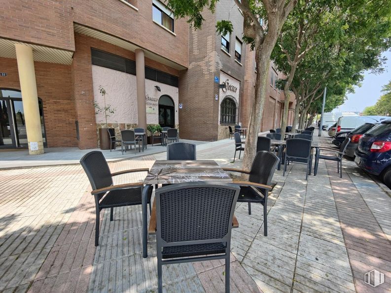 Retail for sale at Parque de los Estados, Fuenlabrada, Madrid, 28945 with chair, car, furniture, table, building, window, tree, wood, outdoor table and road surface around