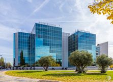 Office for rent at Edificio Egeo, Avenida Partenón, 4-6 , Barajas, Madrid, 28042 with building, plant, cloud, sky, daytime, property, skyscraper, tree, urban design and tower block around