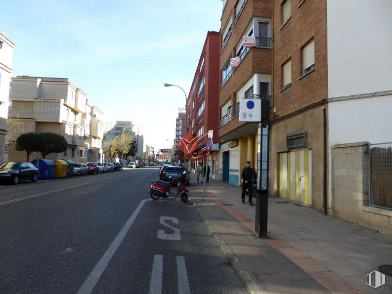 Industrial for sale at Avenida Reyes Católicos, Cuenca, 16003 with motorcycle, person, building, sky, wheel, daytime, window, tire, car and asphalt around