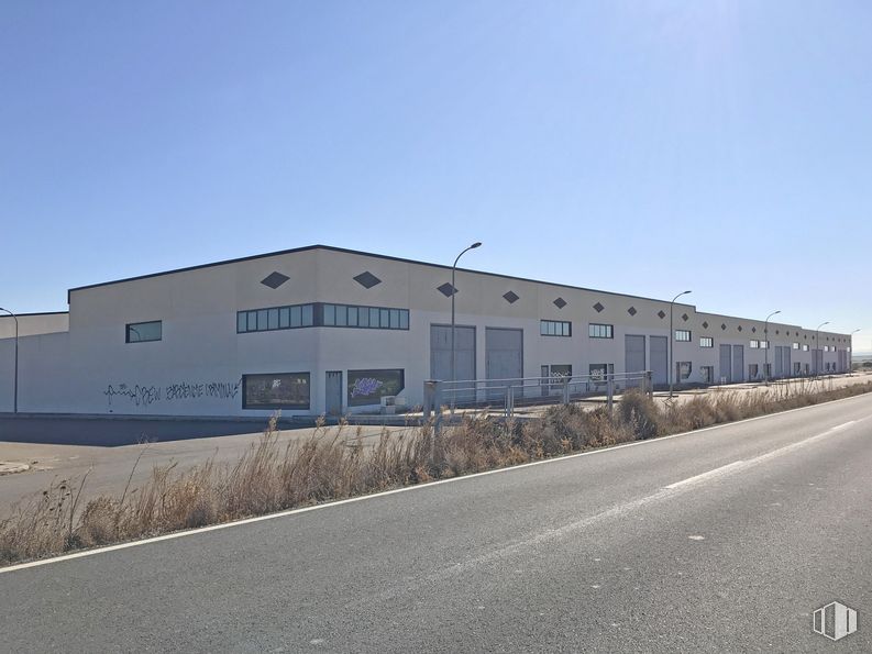 Industrial for sale at Terreno Sector 4, 71, Barcience, Toledo, 45525 with building, sky, window, asphalt, residential area, facade, real estate, tar, road surface and slope around