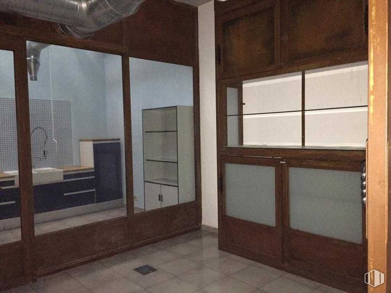 Retail for sale at Calle Fernando Mora, Carabanchel, Madrid, 28019 with cupboard, cabinetry, building, fixture, wood, interior design, floor, door, wood stain and flooring around