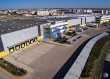 Industrial for rent at Zona Rivas-Vaciamadrid, Puente de Vallecas, Rivas-Vaciamadrid, Madrid, 28529 with sky, transport hub, urban design, building, asphalt, residential area, landscape, commercial building, facade and road around