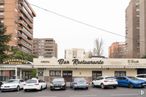 Retail for sale at Calle Perú, 18, Coslada, Madrid, 28820 with car, building, automotive parking light, land vehicle, vehicle, sky, property, wheel, window and infrastructure around