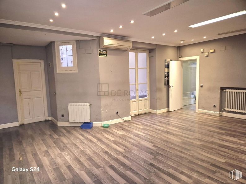 Office for rent at Calle Serrano, Salamanca, Madrid, 28006 with door, light fixture, window, lighting, flooring, floor, wood flooring, wood, interior design and ceiling around