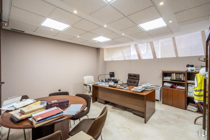 Office for sale at Zona Auditorio, Las Rozas de Madrid, Madrid, 28230 with desk, chair, person, table, lighting, clothing, light fixture, book, furniture and interior design around