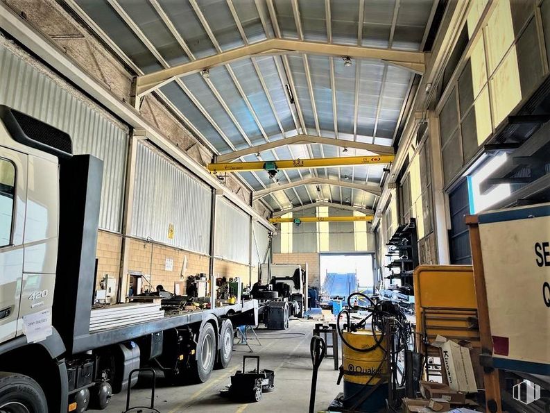 Industrial for sale at Poligono Alcamar, Camarma de Esteruelas, Madrid, 28816 with tire, wheel, motor vehicle, building, interior design, automotive design, engineering, window, vehicle and machine around