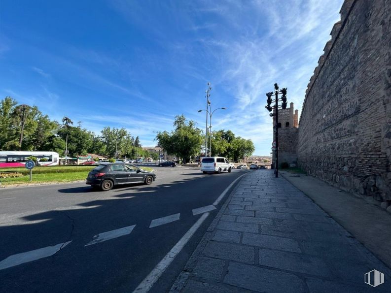 Retail for sale at Casco Histórico, Toledo, 45003 with car, bus, cloud, sky, vehicle, street light, wheel, tree, road surface and asphalt around