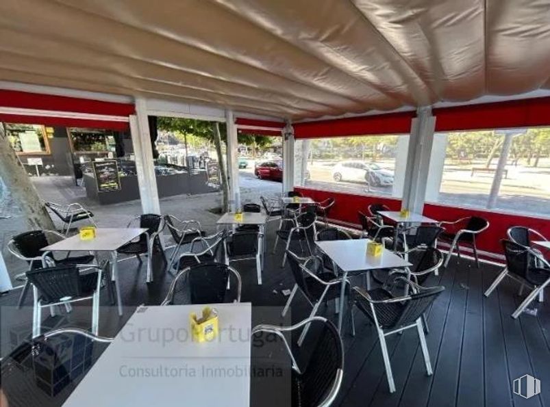 Retail for sale at Zona Aluche, La Latina, Madrid, 28024 with chair, property, furniture, building, table, vehicle, window, shade, automotive design and automotive tire around