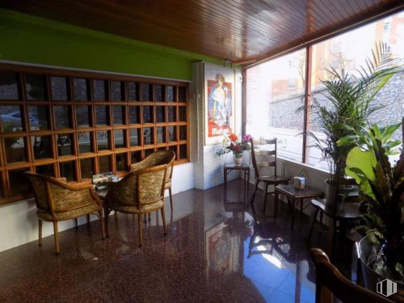 Retail for sale at Calle Eras del Tío Cañamón, Cuenca, 16004 with chair, furniture, plant, property, table, building, window, houseplant, interior design and wood around