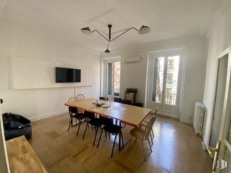 Office for rent at Calle Ferraz, Moncloa - Aravaca, Madrid, 28008 with chair, kitchen & dining room table, door, television, table, lighting, furniture, flooring, interior design and floor around