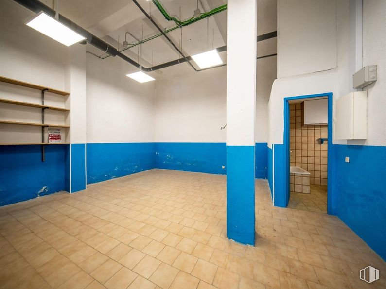 Retail for sale at Calle Mosquilona, Colmenar Viejo, Madrid, 28770 with light fixture, lighting, furniture, blue, flooring, wall, floor, composite material, ceiling and tile around