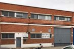 Industrial for sale at Calle Torneros, Getafe, Madrid, 28906 with car, window, building, door, motorcycle, land vehicle, vehicle, sky, motor vehicle and wheel around