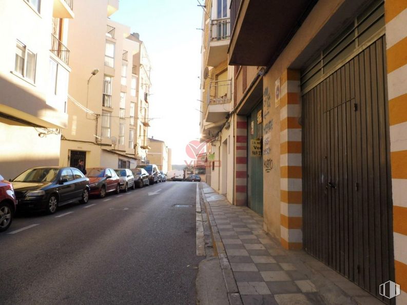 Retail for sale at Zona Renfe, Cuenca, 16004 with car, building, tire, daytime, window, wheel, automotive lighting, infrastructure, vehicle and road surface around