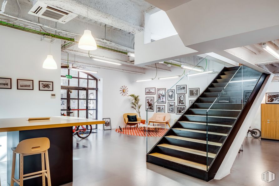 Office for rent at Spaces Río, Calle Manzanares, 4, Arganzuela, Madrid, 28005 with stool, lighting, cabinetry, shelving, stairs, wood, interior design, shelf, building and table around