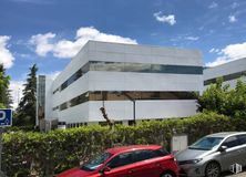 Office for rent at Edificio E, Calle Ochandiano, 10, Moncloa - Aravaca, Madrid, 28023 with car, building, traffic sign, cloud, sky, plant, vehicle, automotive exterior, tree, urban design and shade around