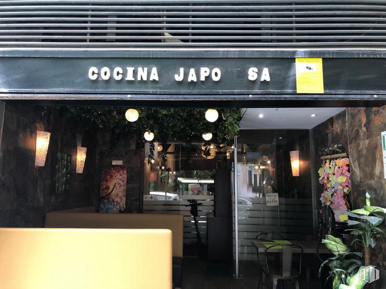 Retail for sale at Calle Andrés Mellado, 18, Chamberí, Madrid, 28015 with houseplant, building, plant, flowerpot, awning, chair, font, table, door and window around