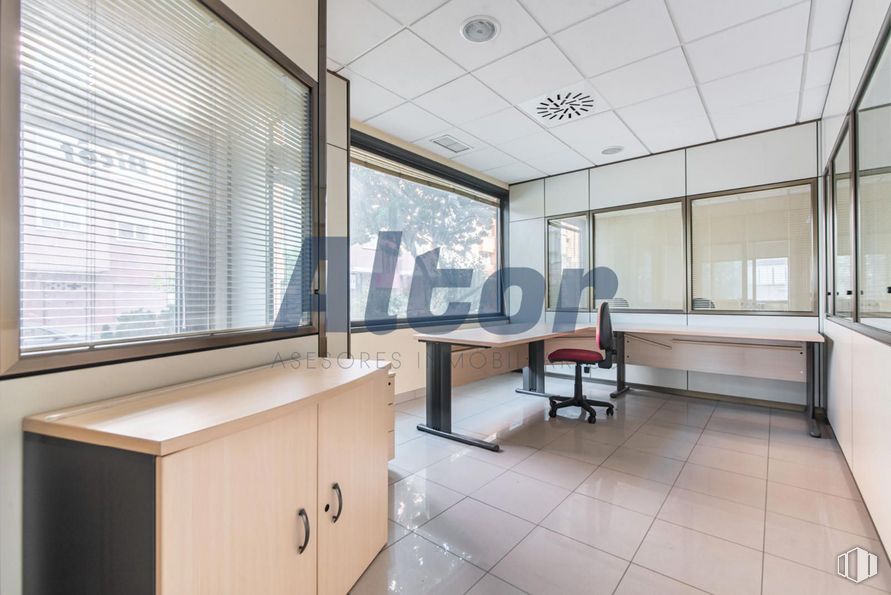 Retail for sale at Calle Rocinante, Fuencarral - El Pardo, Madrid, 28034 with chair, window blind, window, cabinetry, desk, furniture, building, fixture, interior design and wood around