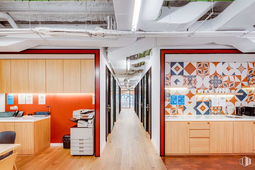 Office for rent at Spaces Río, Calle Manzanares, 4, Arganzuela, Madrid, 28005 with cabinetry, decoration, table, building, lighting, orange, interior design, wood, floor and flooring around