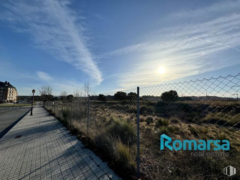 Land for sale at Avenida Juan Carlos I, Ávila, 05004 with building, cloud, sky, plant, azure, natural landscape, grass, asphalt, horizon and fence around