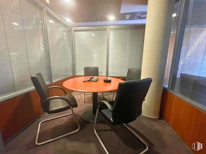 Office for rent at Zona Valdelacasa, Alcobendas, Madrid, 28108 with chair, window blind, window, kitchen & dining room table, table, furniture, building, wood, office chair and orange around