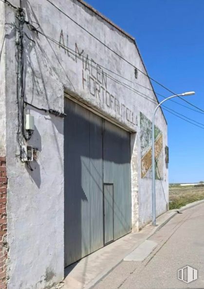 Industrial for sale at Calle Tahona Vieja, Alameda de la Sagra, Toledo, 45240 with door, sky, facade, composite material, fixture, concrete, road surface, electricity, wood and asphalt around