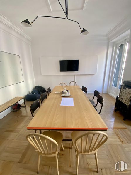 Office for rent at Calle Ferraz, Moncloa - Aravaca, Madrid, 28008 with chair, lighting, table, light fixture, kitchen & dining room table, television, furniture, interior design, flooring and floor around