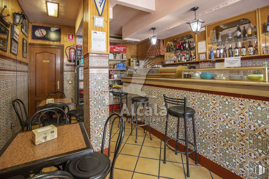 Retail for sale at Zona del Val, Alcalá de Henares, Madrid, 28804 with light fixture, chair, stool, table top, furniture, shelf, interior design, building, shelving and barware around