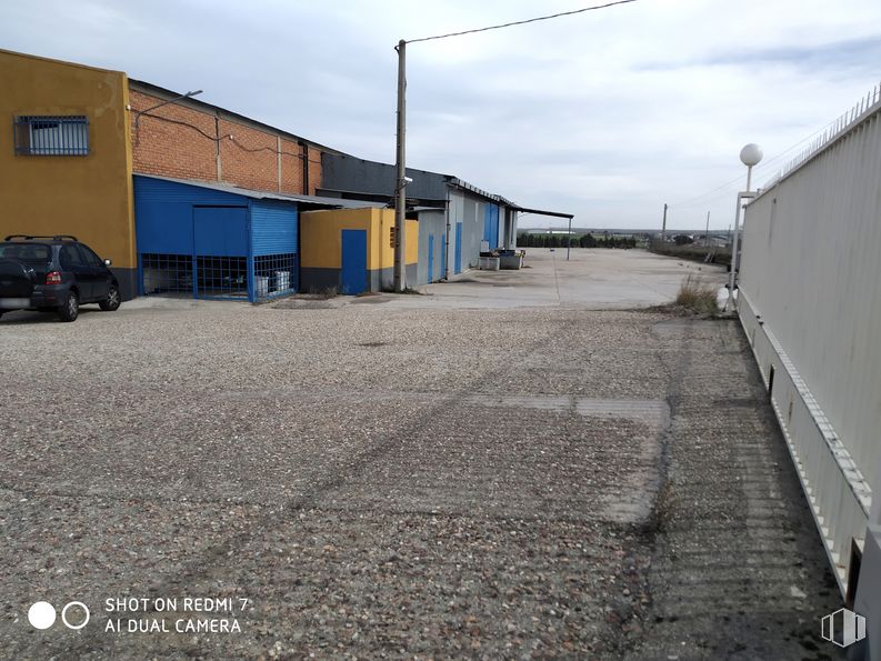 Industrial for rent at Calle Los Sauces, 1, Torrejón de Velasco, Madrid, 28990 with car, automotive parking light, sky, tire, wheel, cloud, vehicle, asphalt, road surface and land lot around