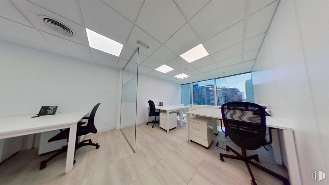 Office for rent at Paseo Castellana, Salamanca, Madrid, 28046 with desk, chair, table, property, building, computer, interior design, office chair, personal computer and flooring around