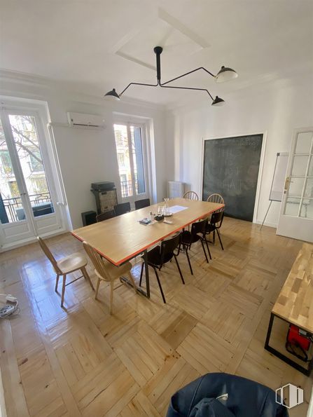 Office for rent at Calle Ferraz, Moncloa - Aravaca, Madrid, 28008 with chair, kitchen & dining room table, window, lighting, table, light fixture, furniture, flooring, floor and interior design around