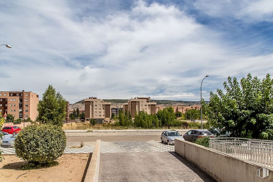 Land for sale at Calle María Luisa Menéndez Calleja, Cuenca, 16003 with building, plant, cloud, sky, daytime, street light, road surface, infrastructure, asphalt and urban design around