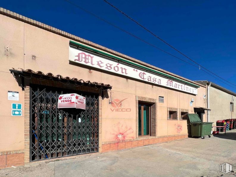 Retail for sale at Avenida Huerta Abajo, San Lorenzo de la Parrilla, Cuenca, 16770 with door, waste container, building, sky, window, fixture, facade, gas, font and city around