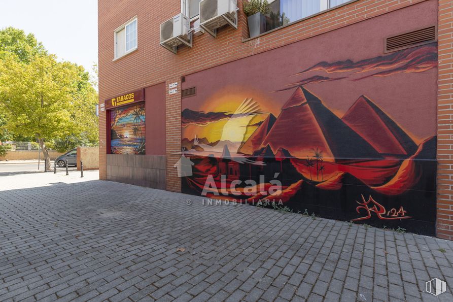 Retail for sale at Calle Píop Baroja, Alcalá de Henares, Madrid, 28806 with window, building, daytime, orange, tree, art, road surface, neighbourhood, brick and urban design around