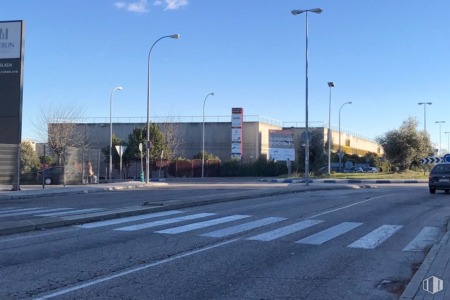 Industrial for rent at SEGRO Park Coslada I, Zona industrial , Coslada, Madrid, 28820 with street light, building, sky, road surface, asphalt, tree, urban design, thoroughfare, residential area and sidewalk around