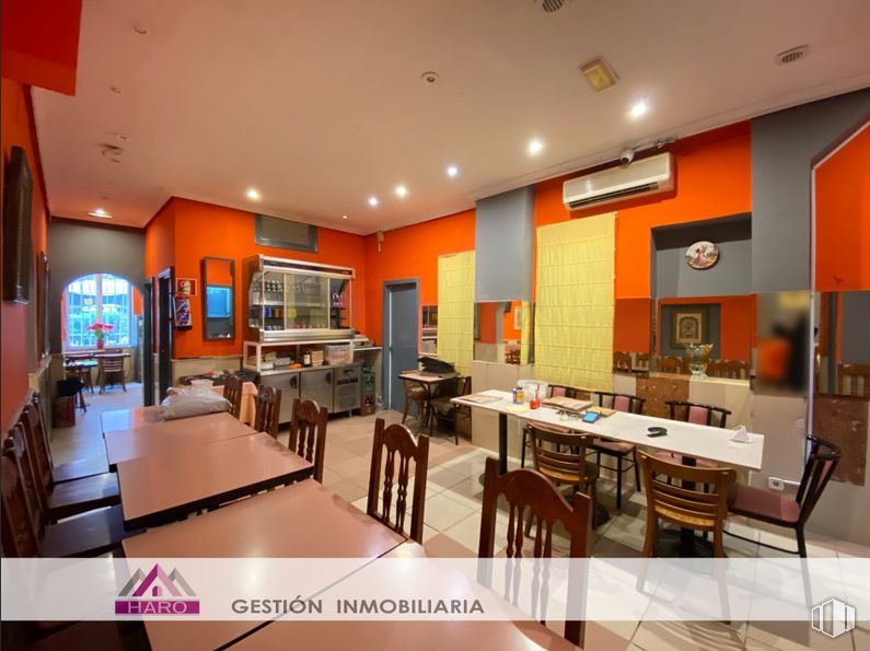 Retail for rent at Calle Hernani, 48, Tetuán, Madrid, 28020 with table, chair, furniture, property, building, kitchen, orange, lighting, interior design and countertop around