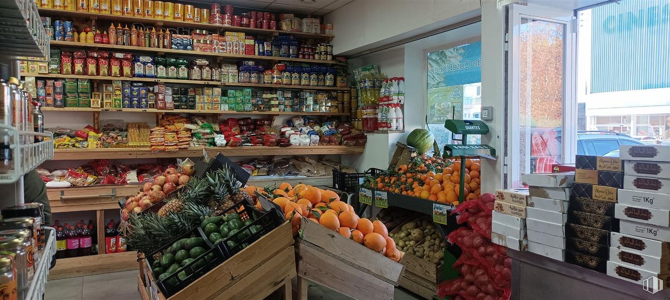 Retail for sale at Avenida Barcelona, Guadalajara, 19005 with food, selling, natural foods, shelf, greengrocer, whole food, retail, food group, market and building around