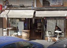 Retail for sale at Calle Cerro de la Alcazaba, Puente de Vallecas, Madrid, 28053 with car, person, chair, clothing, restaurant, shade, awning and customer around