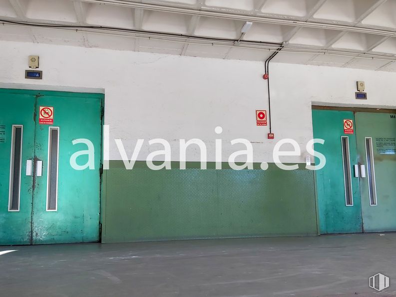 Industrial for sale at Calle Gamonal, Villa de Vallecas, Madrid, 28031 with door, fixture, building, gas, font, facade, composite material, signage, concrete and electric blue around