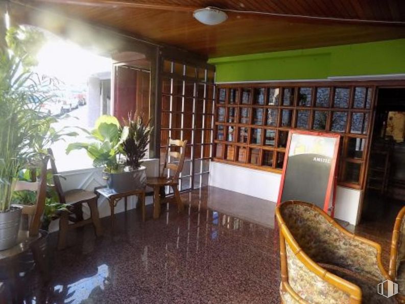 Retail for sale at Calle Eras del Tío Cañamón, Cuenca, 16004 with chair, plant, furniture, building, bookcase, table, wood, shelf, interior design and houseplant around