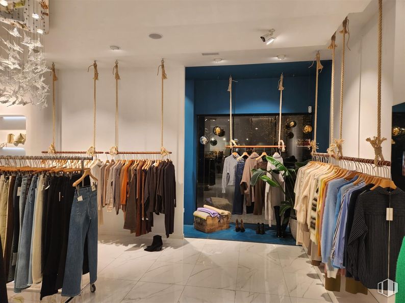 Retail for sale at Zona centro, Villanueva de la Cañada, Madrid, 28691 with lighting, clothing, pants, retail, boutique, interior design, clothes hanger, light fixture, ceiling and natural material around