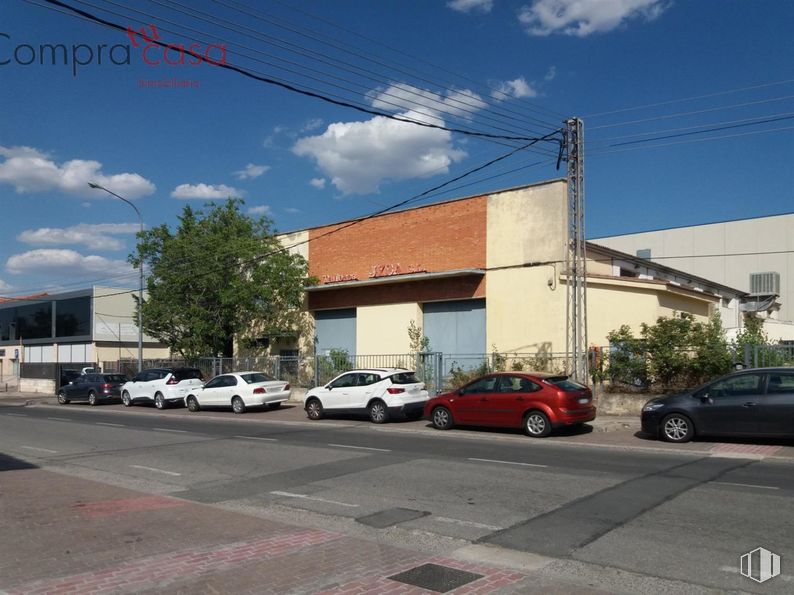 Industrial for sale at Polígono Industrial El Cerro, Segovia, 40006 with car, cloud, automotive parking light, wheel, sky, land vehicle, tire, building, vehicle and road surface around