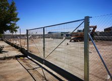 Land for sale at Avenida de los Yeseros, Valdemoro, Madrid, 28341 with sky, fence, mesh, road surface, wire fencing, tree, plant, asphalt, shade and wood around