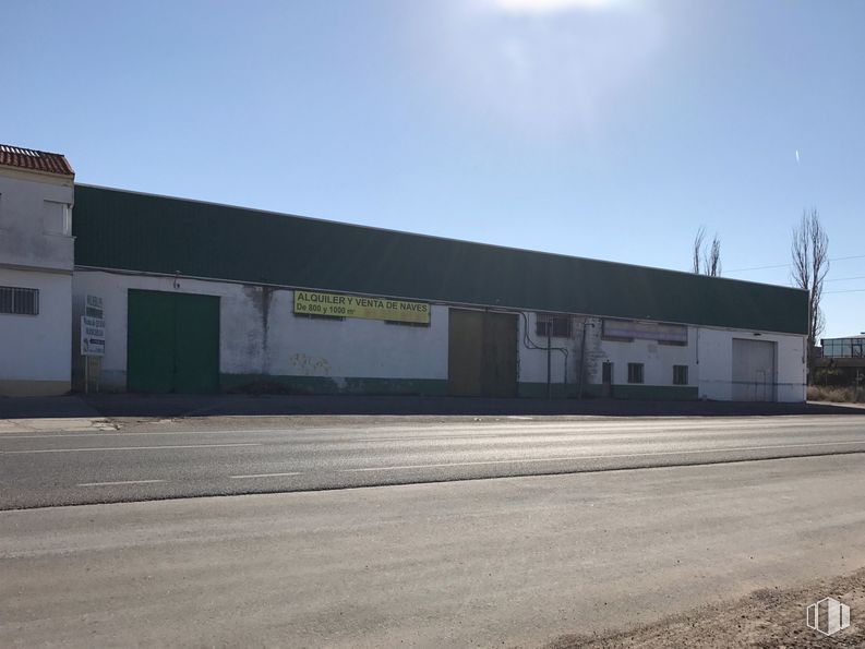 Industrial for sale at Carretera Ocaña, Noblejas, Toledo, 45350 with building, door, sky, natural environment, window, asphalt, fixture, facade, landscape and commercial building around